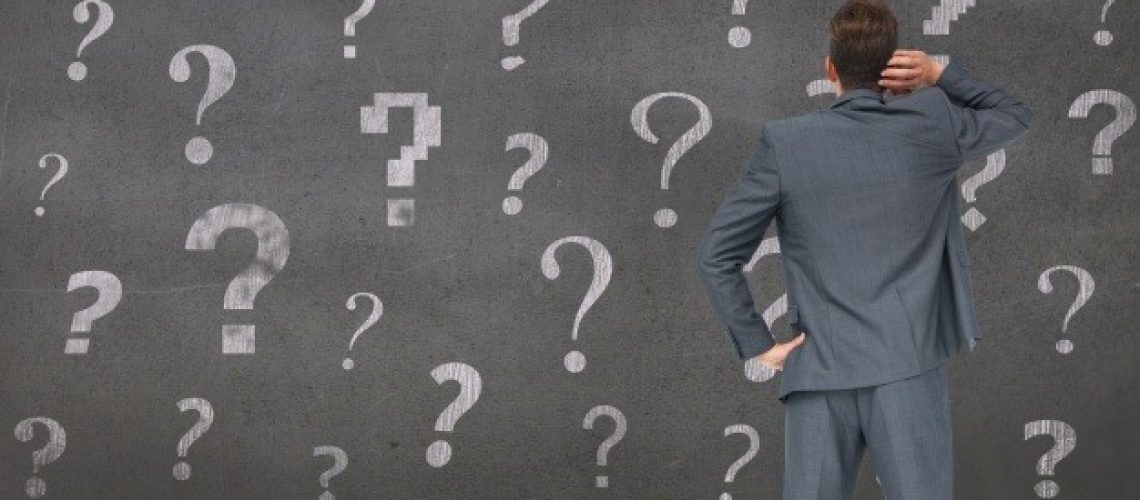 pensive-man-with-question-marks-background_1134-620
