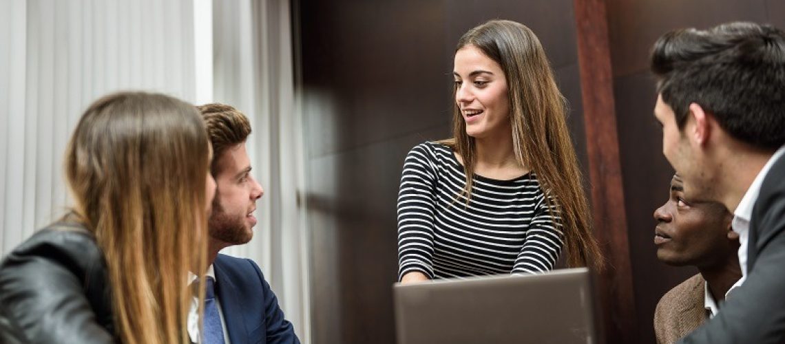 Businesspeople, teamwork. Group of multiethnic busy people working in an office